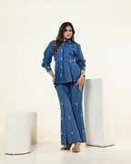 THE DARK DENIM EMBELLISHED PEPLUM FLAP SHIRT WITH HIGH SLIT CUT PANTS