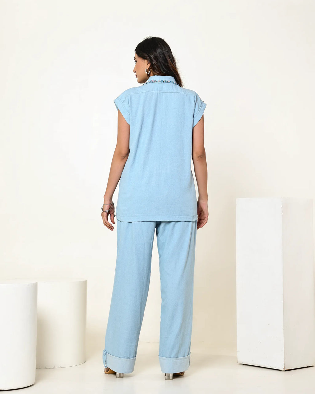 THE LIGHT DENIM SLEEVELESS FLAP EMBELLISHED SHIRT WITH HIGH WAISTED PANTS