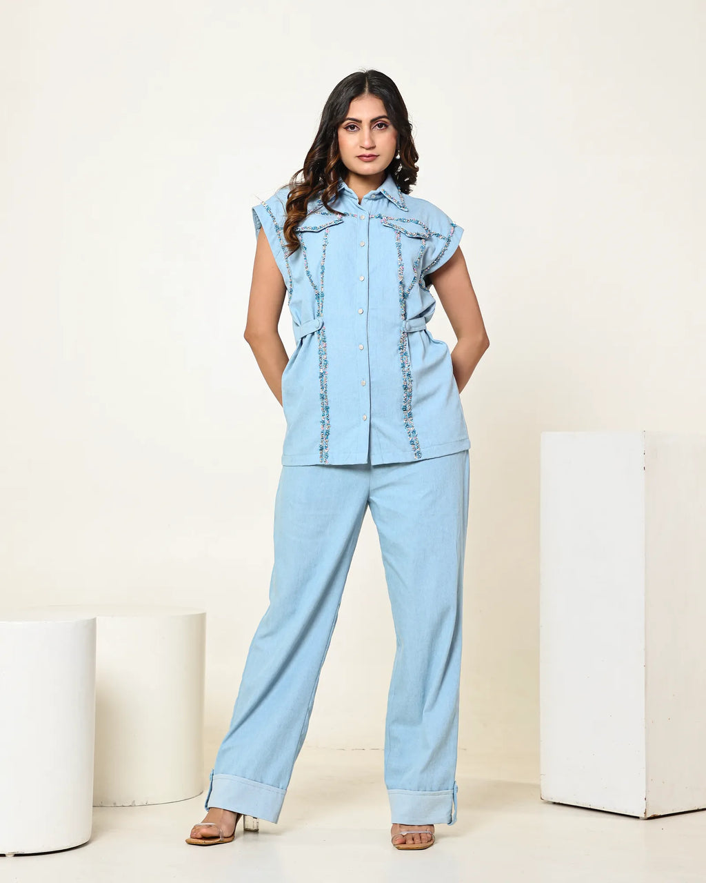THE LIGHT DENIM SLEEVELESS FLAP EMBELLISHED SHIRT WITH HIGH WAISTED PANTS