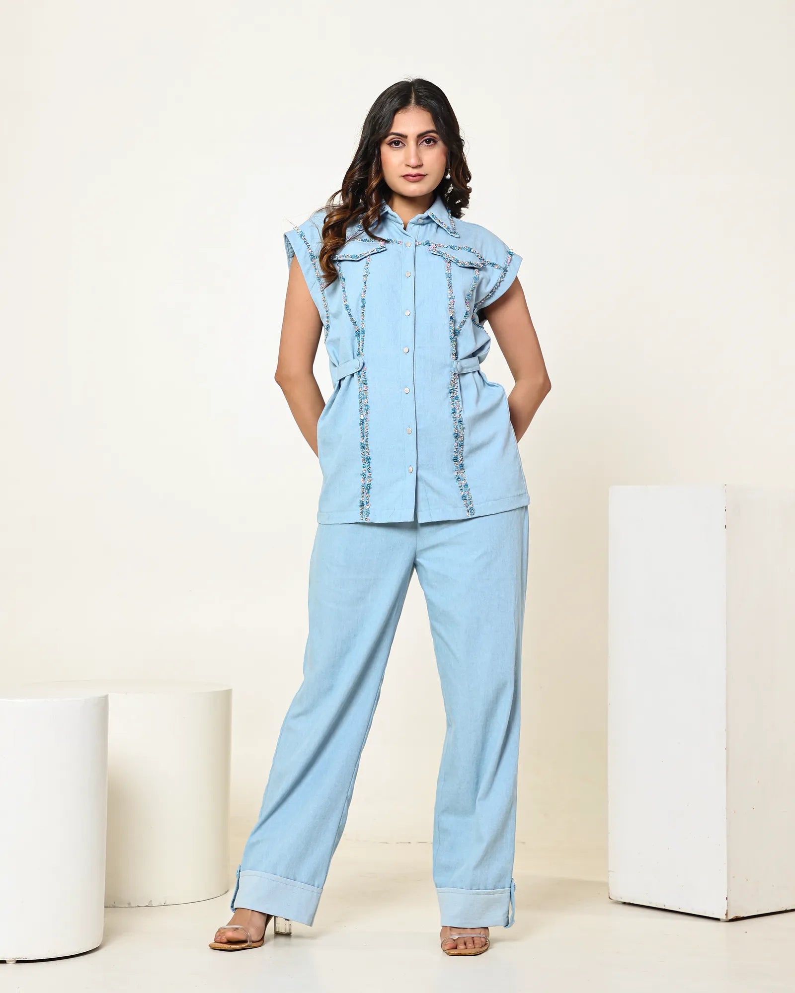 THE LIGHT DENIM SLEEVELESS FLAP EMBELLISHED SHIRT WITH HIGH WAISTED PANTS