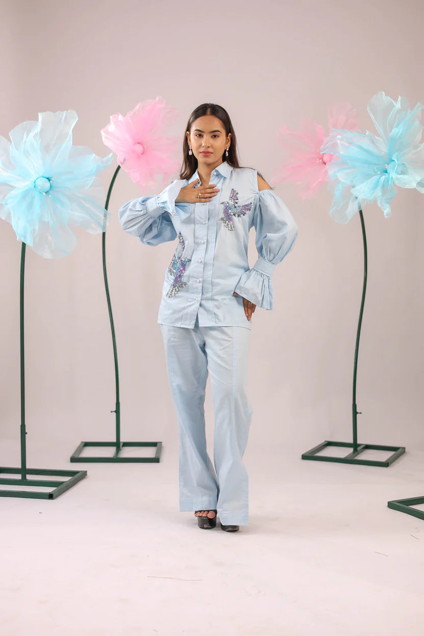 THE SKY BLUE COLD SHOULDER BIRD EMBELLISHED COTTON SHIRT