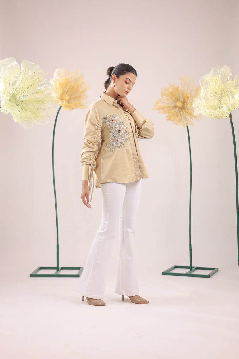 THE BEIGE FLORAL EMBELLISHMENT WITH POCKET AND GATHERED SLEEVES