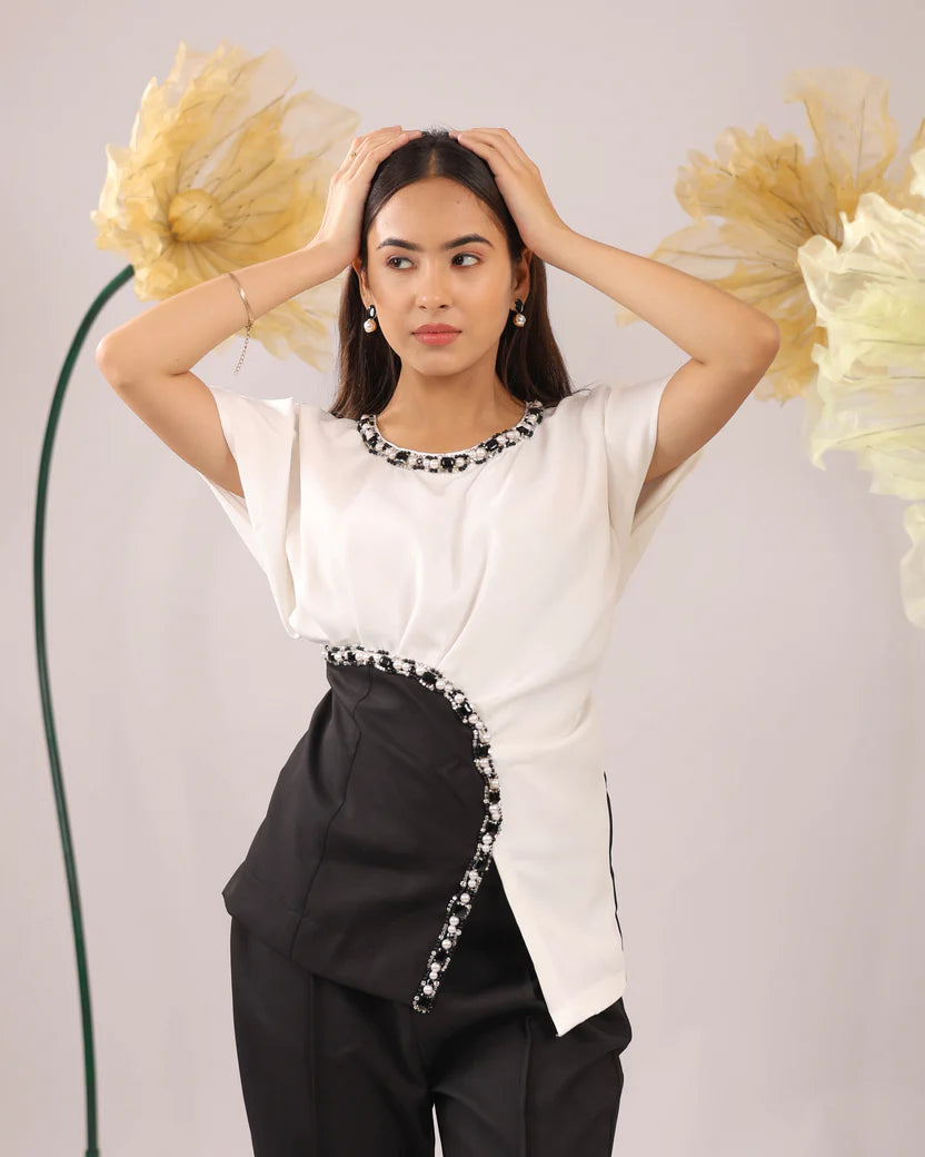 The white and black embellished drape co-ord set