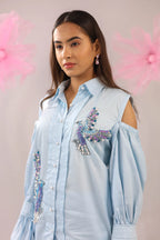 THE SKY BLUE COLD SHOULDER BIRD EMBELLISHED COTTON SHIRT