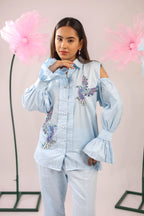 THE SKY BLUE COLD SHOULDER BIRD EMBELLISHED COTTON SHIRT