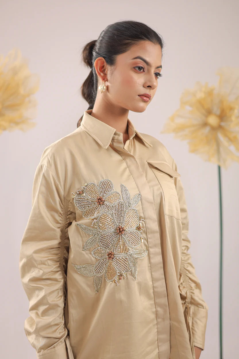 THE BEIGE FLORAL EMBELLISHMENT WITH POCKET AND GATHERED SLEEVES