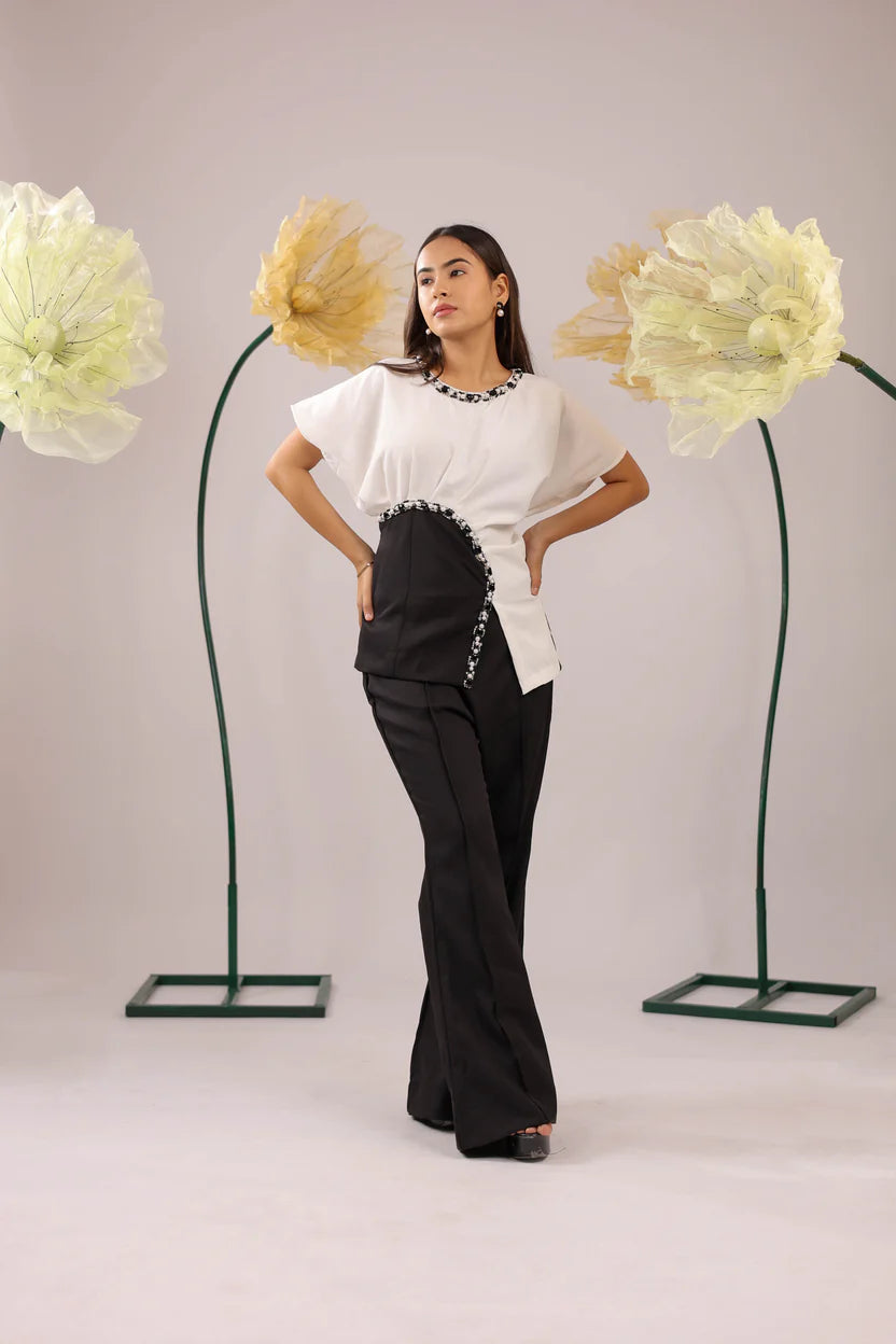 The white and black embellished drape co-ord set