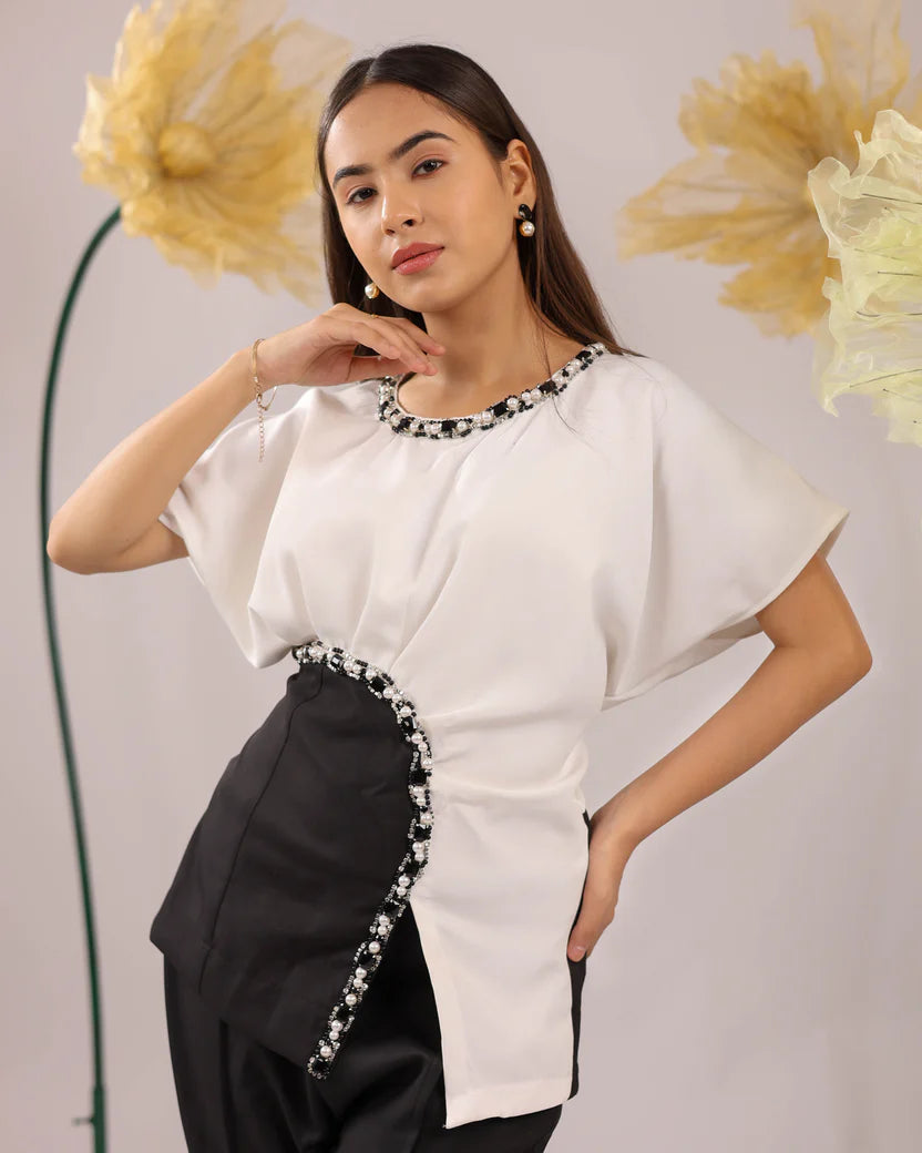 The white and black embellished drape co-ord set