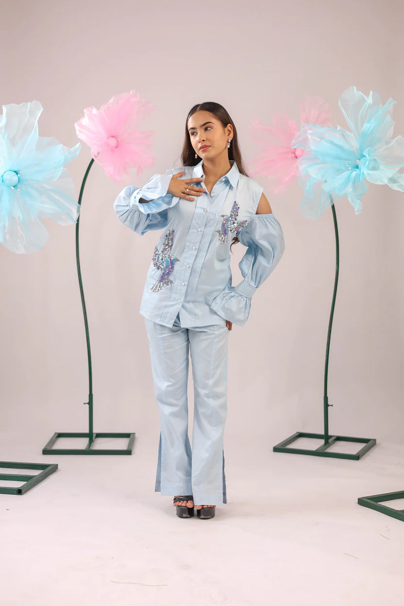 THE SKY BLUE COLD SHOULDER BIRD EMBELLISHED COTTON SHIRT