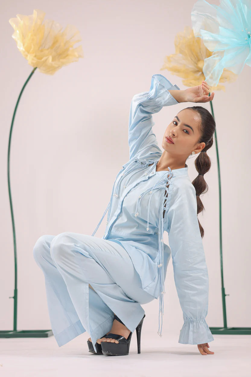 THE SKY BLUE PEARL DROP TASSEL PEPLUM SHIRT