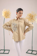 THE BEIGE FLORAL EMBELLISHMENT WITH POCKET AND GATHERED SLEEVES