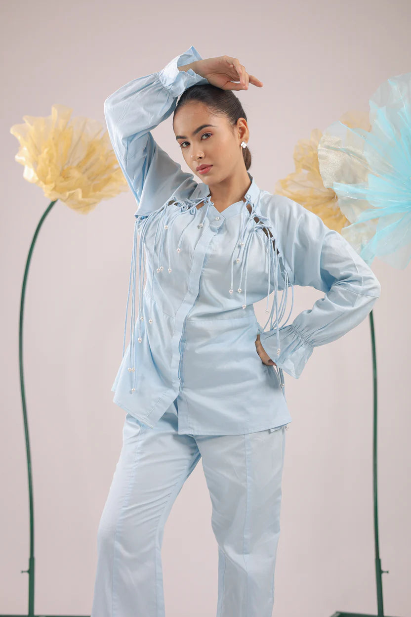THE SKY BLUE PEARL DROP TASSEL PEPLUM SHIRT